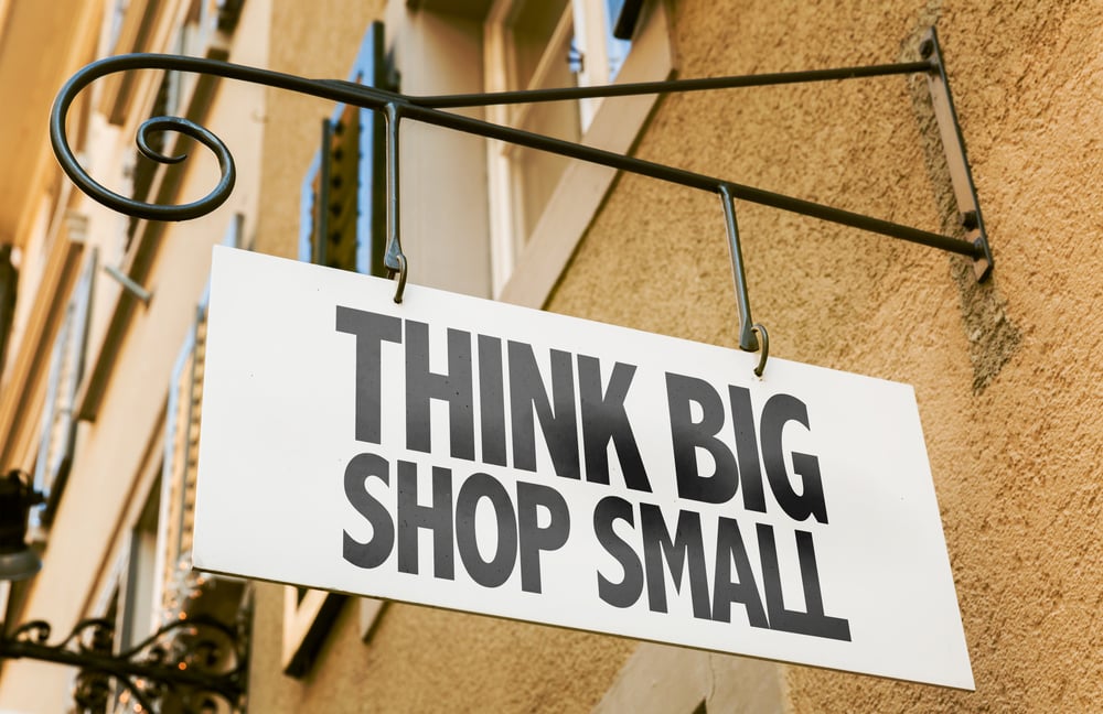 image of a business sign that says think big, shop small